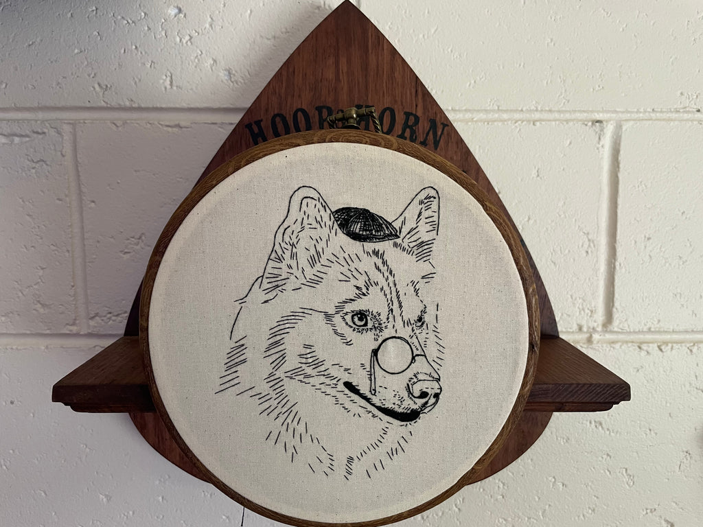 Round embroidery hoop , outline embroidered husky 