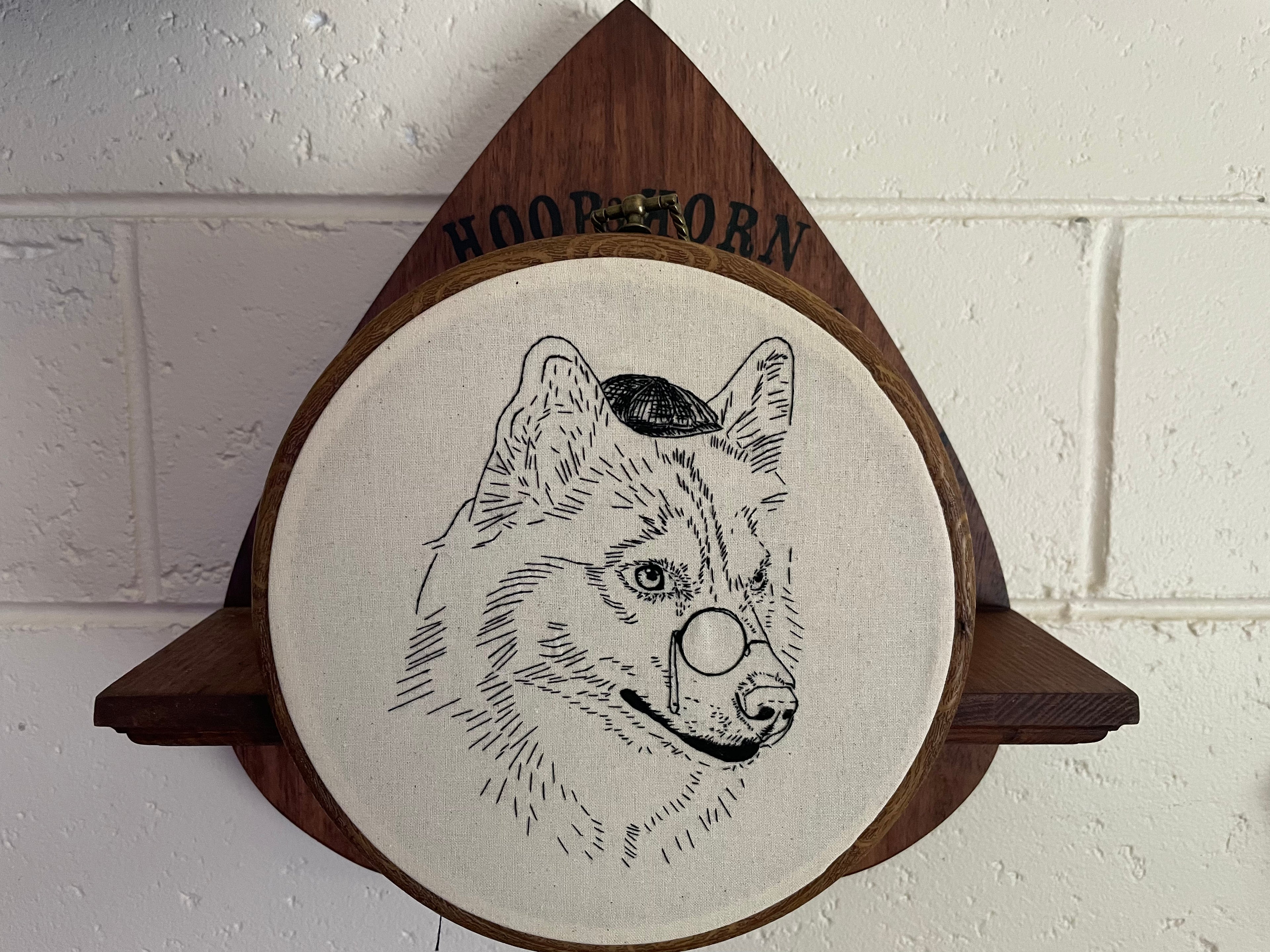 Round embroidery hoop , outline embroidered husky 